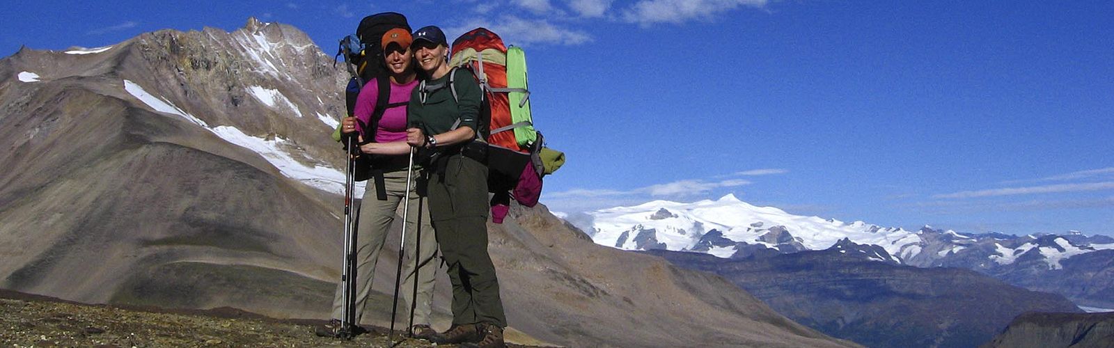 Backpackers on ridge of the Goat Trail,  Wrangell St. Elias National Park, Alaska